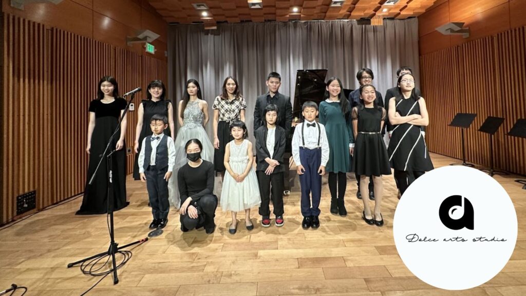 A group of music students at Dolce Arts Studio taking a group shot before a performance.