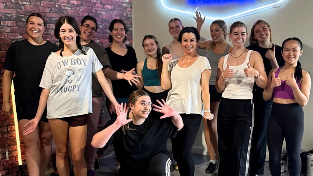 A group of dancers at Drop In Dance Winnipeg, posing for a photo.