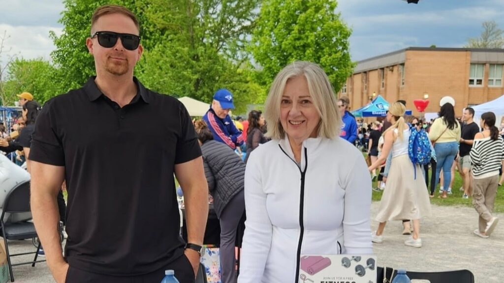 The owners of Highland Fitness and Wellness, at a busy festival meeting new clients.