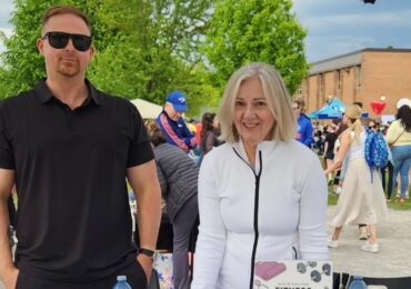 The owners of Highland Fitness and Wellness, at a busy festival meeting new clients.