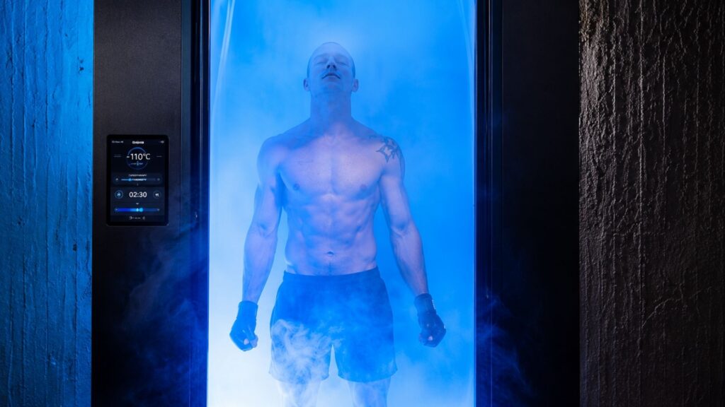 A man stands in a steamy cryo-chamber at Ignite Cryo+Sauna.