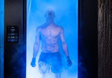 A man stands in a steamy cryo-chamber at Ignite Cryo+Sauna.