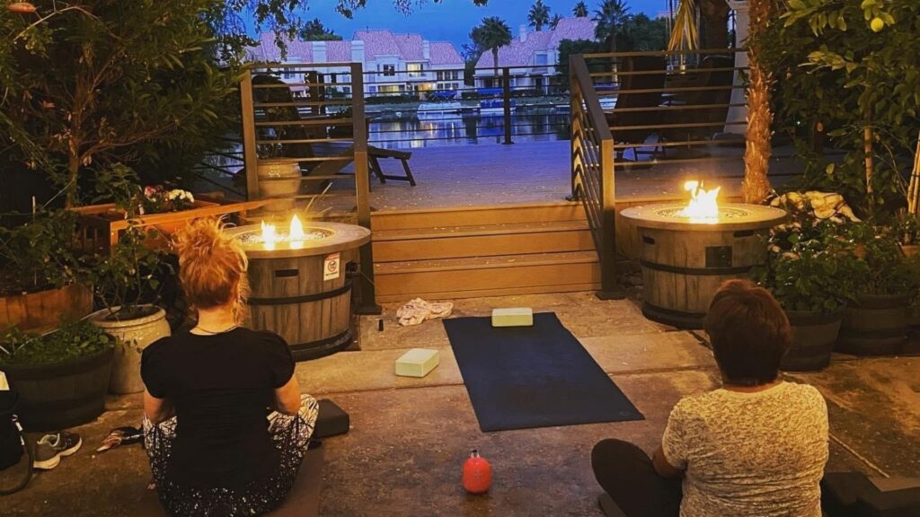 A packed yoga class by candlelight at The Spa at Lakeside.