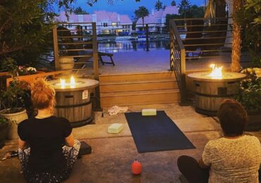 A packed yoga class by candlelight at The Spa at Lakeside.
