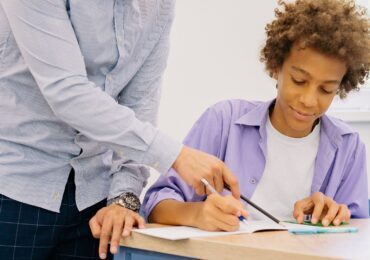 A student learning with his tutor at Squarepeg Learning.