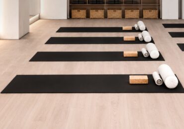 The Ember Pilates studio, with yoga mats laid out for a packed class.