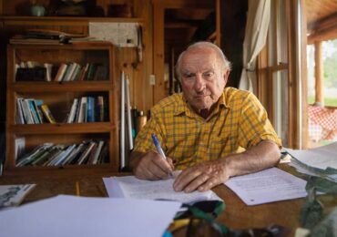 The founder of Patagonia, writing at his desk.