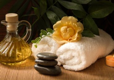 A beautiful arrangement of towels, oils, candles, and other spa necessities at Elemental Life Spa.