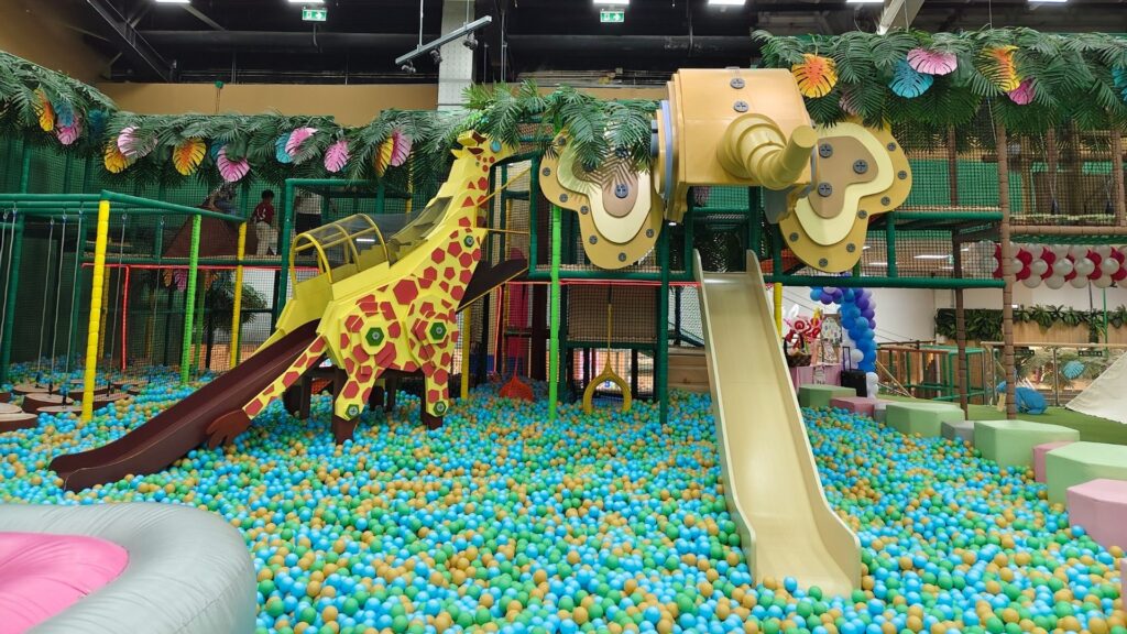 A colorful play cafe with a jungle theme, run with WellnessLiving's custom software.