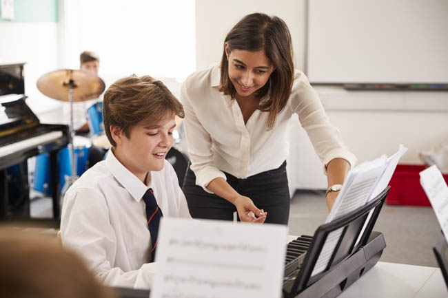 Planning Music Recitals, teacher instructs student