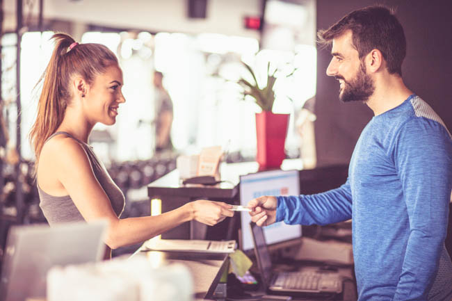 Black Friday Marketing, Woman checking in at a gym 