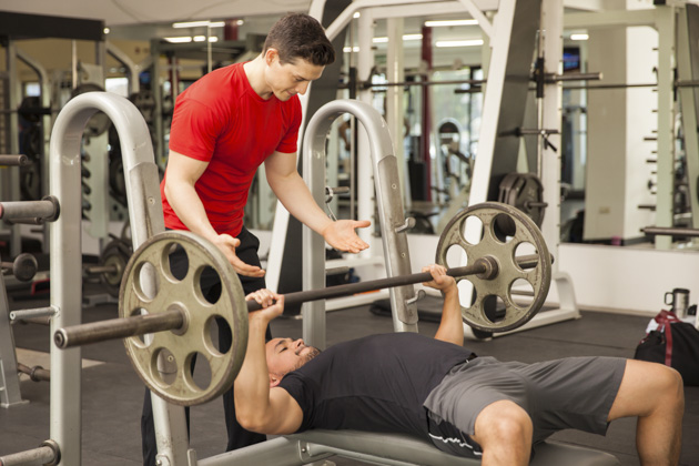 Get Fitness Clients, Young man Spotting Another Man