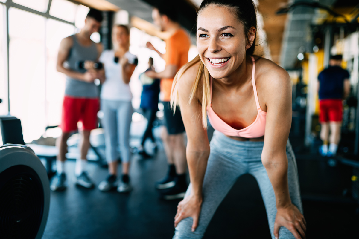 new year's fitness resolutions, happy woman at the gym