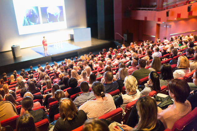 Fitness Studio Promotion, group listening to a public speaker