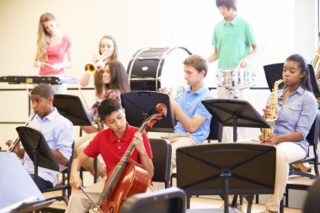 grow your music business, Pupils Playing Musical Instruments In School Orchestra