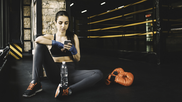 martial arts social media marketing, young boxer on phone
