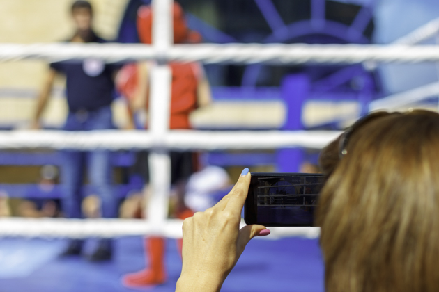 martial arts social media marketing, woman taking boxing video