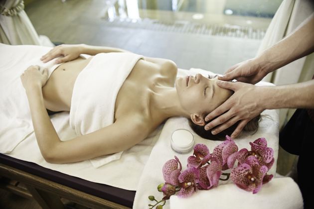 wellness center management software, woman getting a massage
