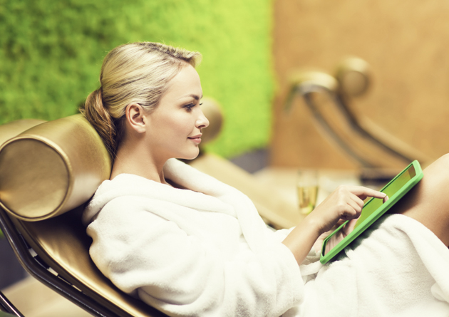 wellness center social media, woman checking tablet