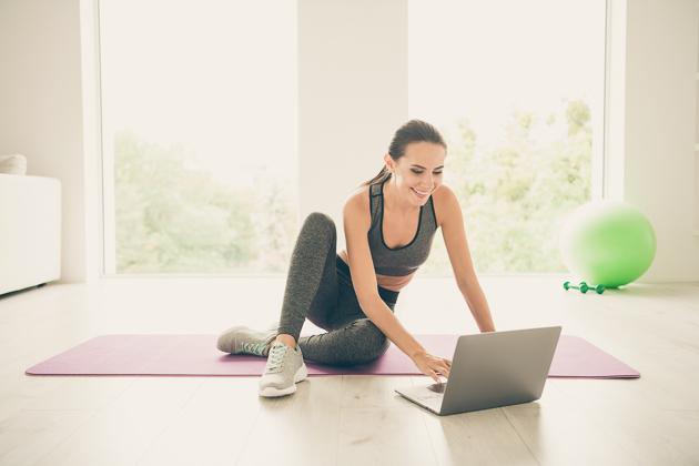 2020 Pilates trend, Pilates instructor with laptop