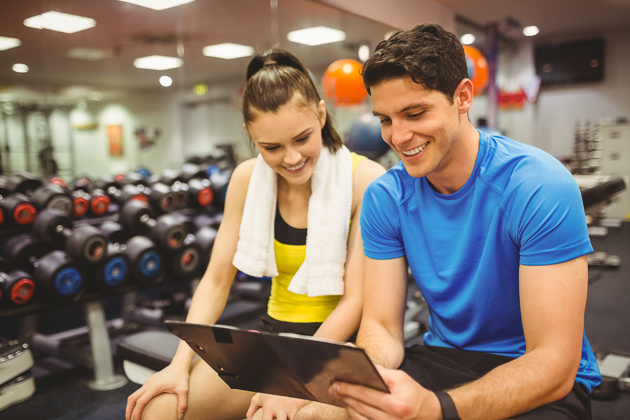 how to upsell gym memberships, trainer and client talking