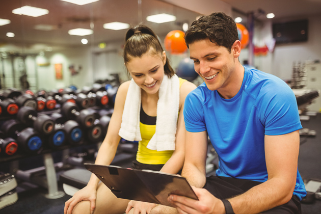 how to upsell gym memberships, trainer and client talking