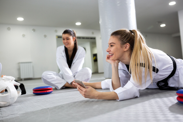 martial arts software, martial arts student with phone