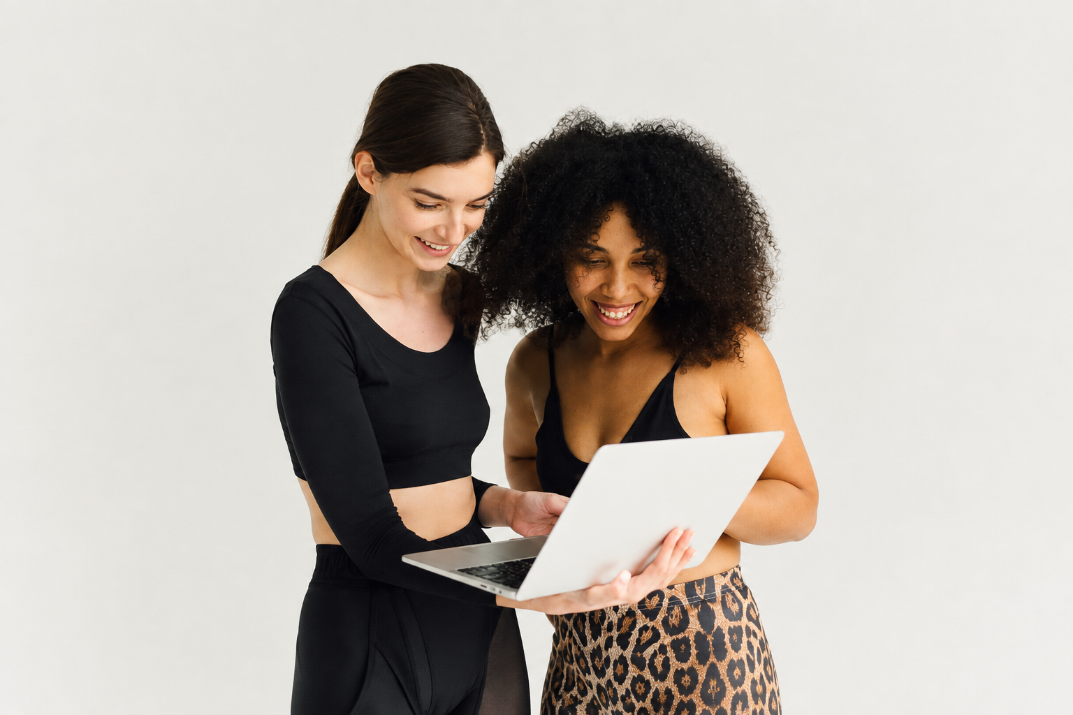 two-women-laptop-reviewing-fitgrid